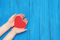 Red heart in child`s hands Royalty Free Stock Photo