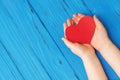 Red heart in child`s hands Royalty Free Stock Photo