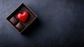 Red heart chocolate and dark chocolates in a box Royalty Free Stock Photo