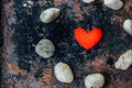 Red heart in circle of rocks Royalty Free Stock Photo