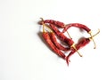 Red heart composed of red chili peppers on white background. Symbol of love Royalty Free Stock Photo