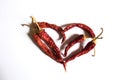 Red heart composed of red chili peppers on white background. Symbol of love Royalty Free Stock Photo