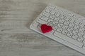 Red heart on computer keyboard