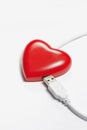 Red heart connect with USB plug Royalty Free Stock Photo