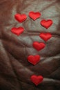 Red heart dark leather background
