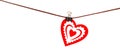 Red heart from dense fabric on a clothespeg on a rope