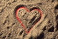 Red heart drawn in the sand Royalty Free Stock Photo