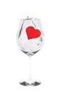 Red heart drop into wine glass