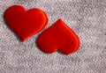 Red heart on fabric background knitted beautiful
