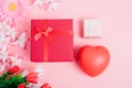 Red heart, flower and gift box on pink background Royalty Free Stock Photo