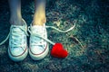 Red heart beside the foot Royalty Free Stock Photo