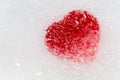 Red heart frozen in ice