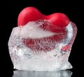 Red heart frozen in ice