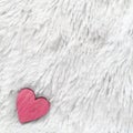 Red heart on fur white background. Composition for Valentines day or wedding.Place for text. Copy space. Royalty Free Stock Photo