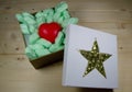 Red heart in gift box with golden star Royalty Free Stock Photo