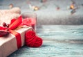 Red heart and gift on a festive background. Royalty Free Stock Photo