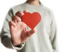 Red heart on the girl hand. Symbol of support that expresses love. Caring, Valentine day and world heart day, heart health concept Royalty Free Stock Photo