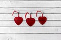 Red Heart Glass hang over white wood background