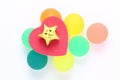 Red heart with gold star on colourful rubber balls Royalty Free Stock Photo