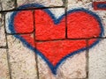 Red heart graffiti on brick wall Royalty Free Stock Photo