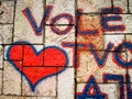 Red heart graffiti on brick wall