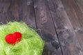 Red heart in grass nest Royalty Free Stock Photo