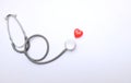 Copy space red heart and gray stethoscope isolate on white doctor table.concept health check and a doctor`s office