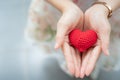 Red heart in hands from above. Healthy, love, donation organ, do Royalty Free Stock Photo