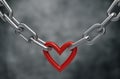 Red heart held by a steel chain background