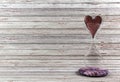 Red heart in hourglass