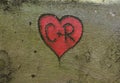 Red heart with Initials,carved in a tree bark