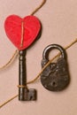 Red heart, key and padlock tied with rope. Symbol of love Royalty Free Stock Photo