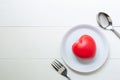 Red Heart with love and dish and spoon and fork on wooden background Royalty Free Stock Photo
