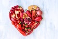 Red heart made from fresh raw fruits and vegetables Royalty Free Stock Photo