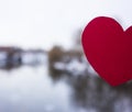 Red heart made of paper on the background of the river Royalty Free Stock Photo