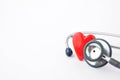 Red heart made of plastic with medical stethoscope isolated from white background. Royalty Free Stock Photo