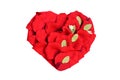 Red heart made of rose petals, isolated on white background Royalty Free Stock Photo