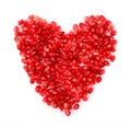 Red heart made from seeds of pomegranate,grenadine on white