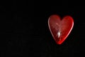 Red Heart Made of Stone isolated on Black Background with copy space Royalty Free Stock Photo