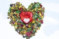 A red heart metal gift box on colorful dried flowers used as wallpaper Royalty Free Stock Photo