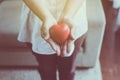 Red heart model on senior woman hands,Health Care and cardiology concept Royalty Free Stock Photo