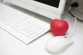 Red heart in office with computer desk set. Mini and small size of sponge heart for Muscle relaxant in hospital. Dating and Royalty Free Stock Photo
