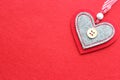 Red heart out of felt on red background Royalty Free Stock Photo