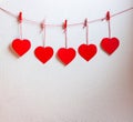Red heart paper cut with natural cord and red clips hanging on the wall, copy space,valentines day - Image Royalty Free Stock Photo