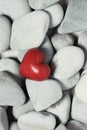 Red heart on pebble stones, still life. Valentines day and lovers background Royalty Free Stock Photo
