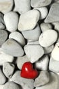 Red heart on pebble stones, still life. Valentines day and lovers background Royalty Free Stock Photo