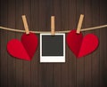 Red heart with photo frame on wood background with clothespin. Vector illustration. EPS 10. Royalty Free Stock Photo