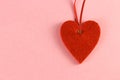 Red heart on a pink background with room for text