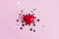 Red heart on pink background with star glitter confetti Royalty Free Stock Photo