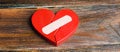 A red heart with a plaster. Renewal of the relationship. Family psychotherapist services. Reconciliation. Saving the family. Royalty Free Stock Photo